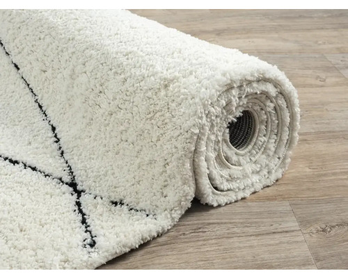 Opgerolde, laagpolige vloerkleed met patroon