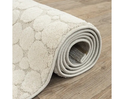 Opgerolde vloerkleed met stippenpatroon