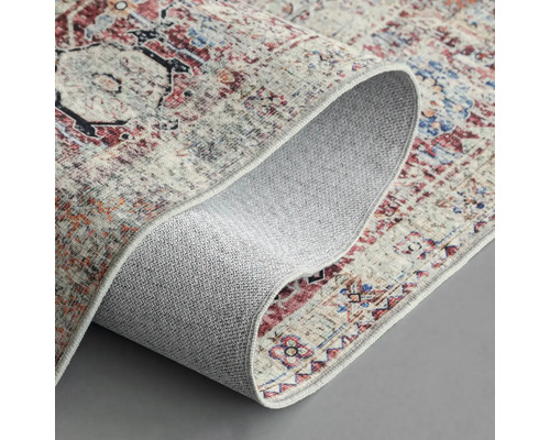 Vloerkleed met meerkleurig patroon en gegolfde rand