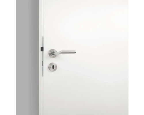 Wit gelakte binnendeur met roestvrijstalen deurbeslag