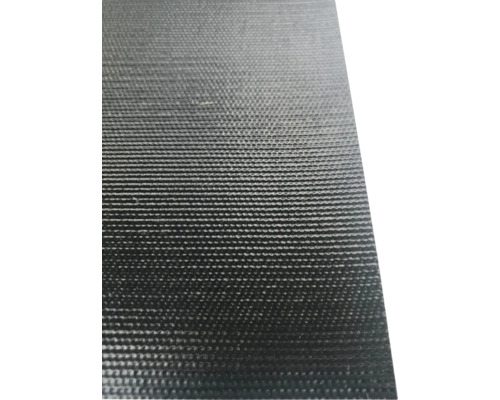 Close-up van een zwarte noppenplaat van kunststof