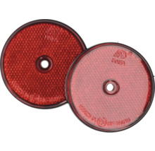 Twee ronde, rode reflectoren