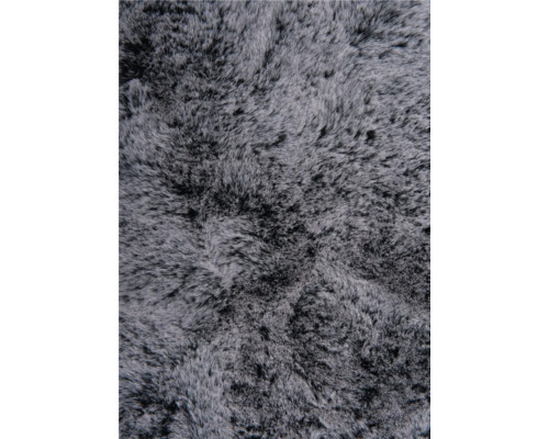 Close-up van een grijs imitatievacht tapijt