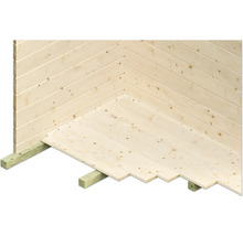 Detailaanzicht van de houten vloer en de houten wand van een tuinhuis.