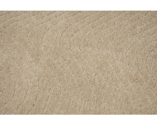 Close-up van een beige tapijt met een golvend patroon