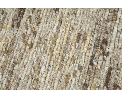 Detailopname van een gevlochten tapijt van natuurlijke vezels