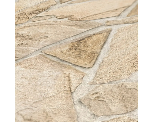 Close-up van een stenen behang met onregelmatig gevormde stenen.