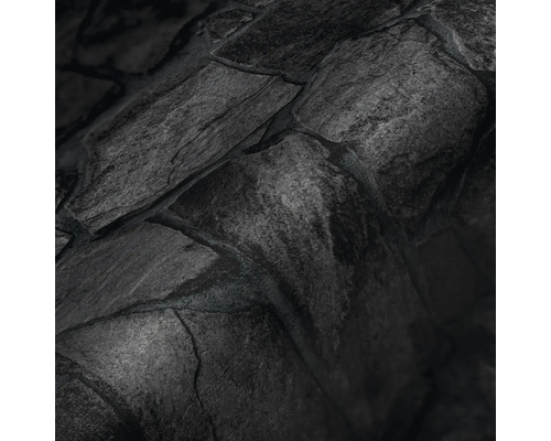 Close-up van een donkere stenen muurstructuur