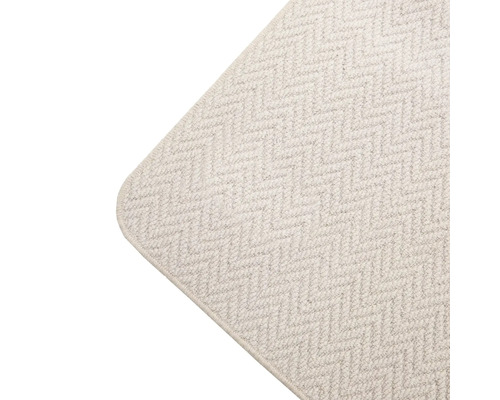 Detailopname van een tapijt met visgraatmotief