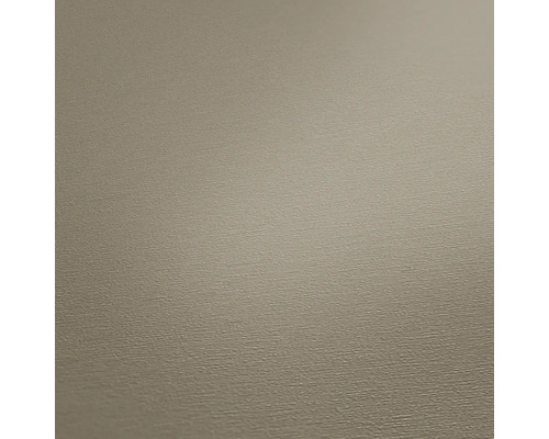 Close-up van een beige vliesbehang met fijne structuur