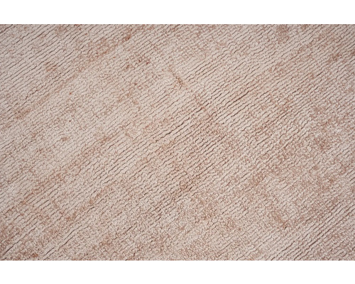 Close-up van een beige tapijt