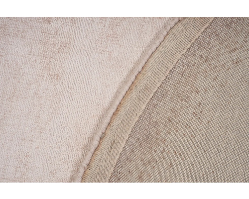 Detailweergave van een beige tapijt met textuur