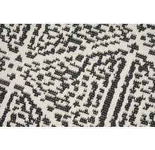 Close-up van een tapijt met geometrisch patroon