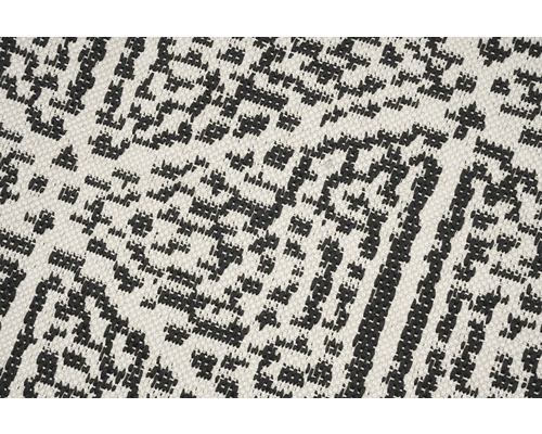 Close-up van een tapijt met geometrisch patroon