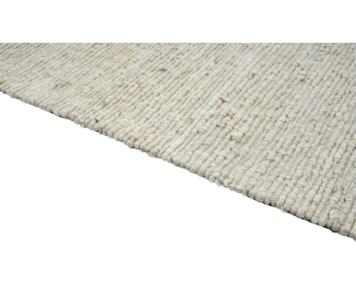 Detailweergave van een geweven vloerkleed van natuurlijke vezels