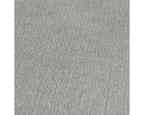 Close-up van een lichtgekleurd structuurbehang