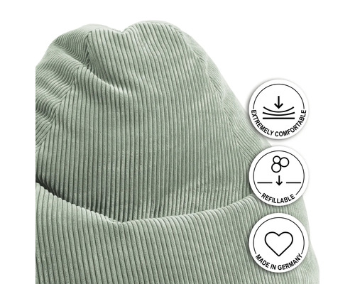 Detailopname zitzak met corduroy hoes en vermeldingen van comfort, navulbaarheid en fabricage in Duitsland