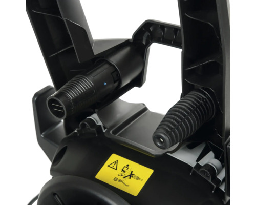 Gedetailleerd beeld van een hogedrukreiniger met aansluitingen en waarschuwingen