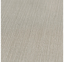 Close-up van een beige behang met linnenstructuur