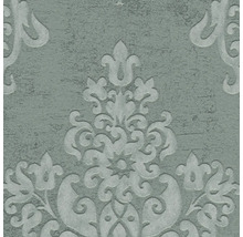 Close-up van een gestructureerd behang met decoratieve bloemmotieven