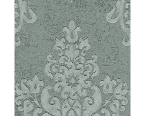 Close-up van een gestructureerd behang met decoratieve bloemmotieven