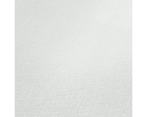 Close-up van een wit textielbehang met een fijne weefstructuur.