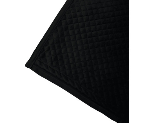 Detail van een gewatteerde, donkere deken met een vierkant patroon