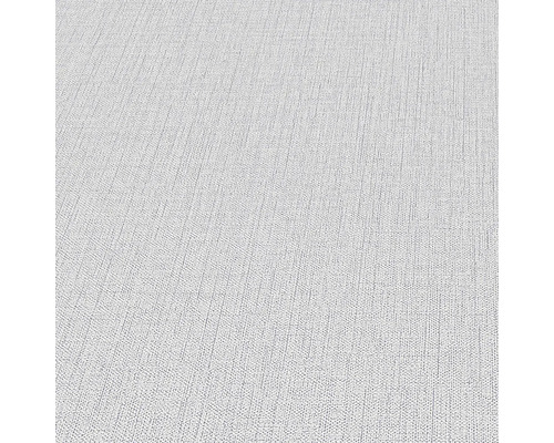 Close-up van een lichtgekleurd textielbehang met fijne structuur