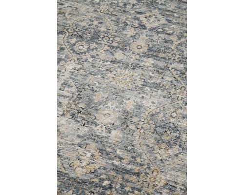 Detailweergave van een tapijt met patroon.