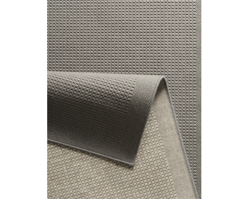 Detailopname van een grijs tapijt met geweven textuur