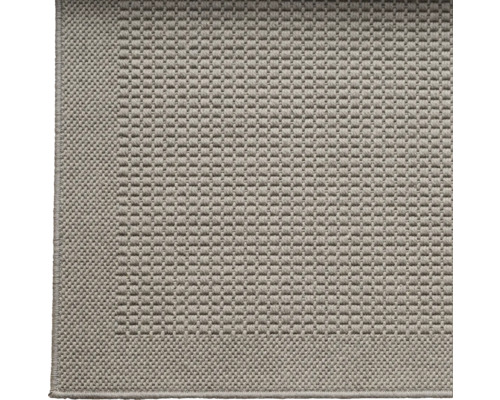 Gedetailleerde opname van een grijs tapijt met geweven structuur