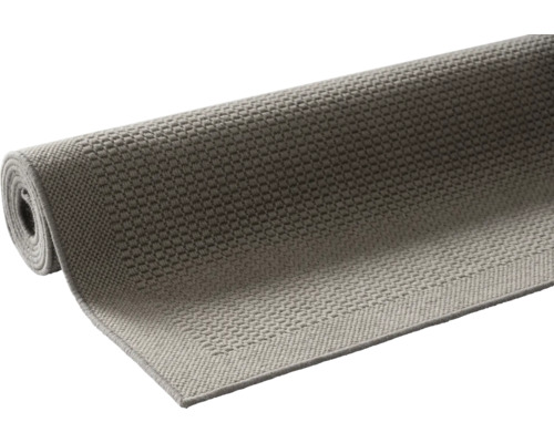 Grijs tapijt, gedeeltelijk opgerold