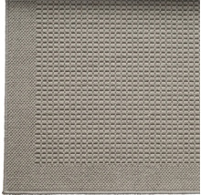 Detailweergave van een tapijt met geweven textuur