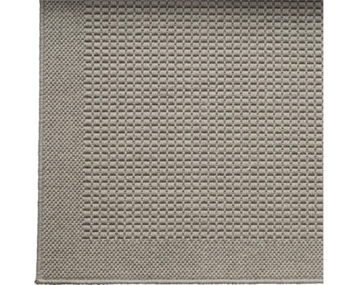 Detailweergave van een tapijt met geweven textuur