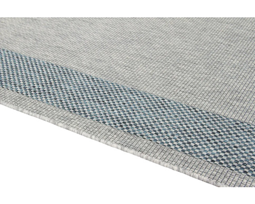 Detailweergave van een rechthoekig tapijt met rand