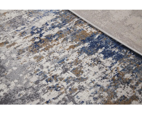 Tapijt met abstract patroon in verschillende grijstinten, blauw en beige
