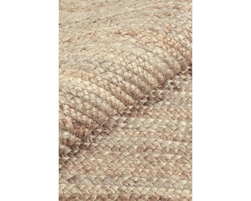 Close-up van een geweven vloerkleed van natuurlijke vezels