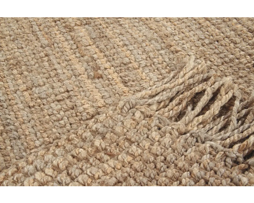 Detailopname van een tapijt met franjes