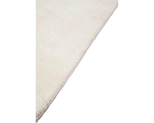 Detail van een lichtgekleurd tapijt