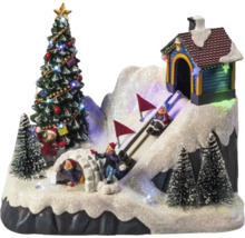 Decoratief winterlandschap met kerstboom, iglo, huis en skiërs