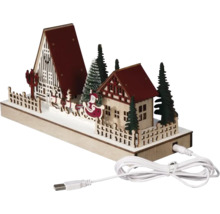 Decoratieve kerstscène met huizen, bomen, slee en USB-kabel