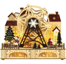 Kerstdecoratie met verlicht reuzenrad, kerstman, sneeuwpop, kerstboom en huizen
