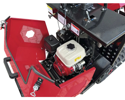 Detail van een motorfrees met open klep en zichtbare motor