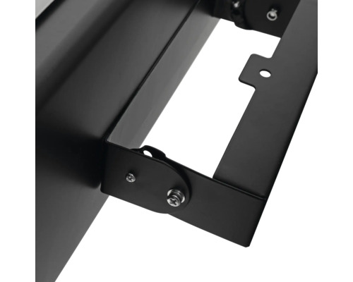 Detail van een zwarte schijnwerper met bevestigingsmaterialen