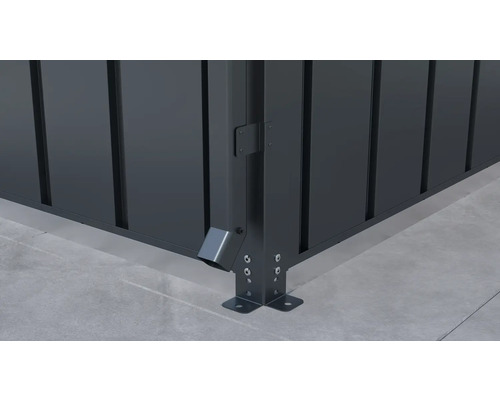 Detailaanzicht van een tuinhuis hoek met waterafvoer en vloerbevestiging