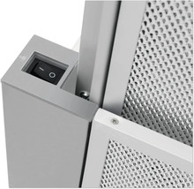 Gedetailleerde weergave van een afzuigkap met schakelaar en metalen filter