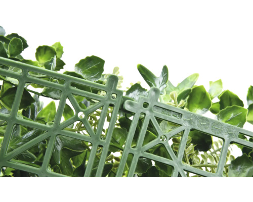 Kunstplantenmat met groene bladeren en kunststof rooster