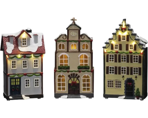 Drie decoratieve kersthuisjes met verlichting