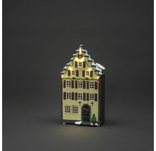 Verlicht kersthuis als decoratie