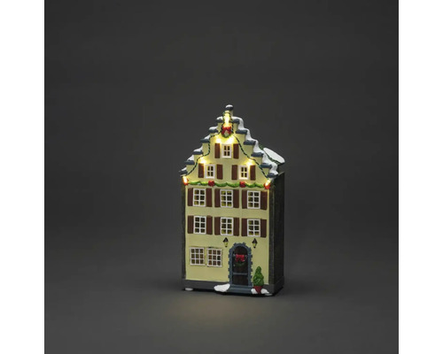 Verlicht kersthuis als decoratie